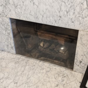 Clear fireplace cover to stop cold drafts of air.