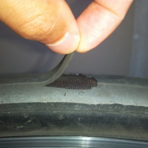 After six months on the road, I've discovered a rip in the tread of my bike.
