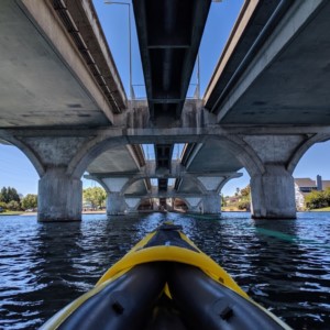 Water sports such as kayaks, stand up paddle board, wind surfing in a Foster City lagoon.